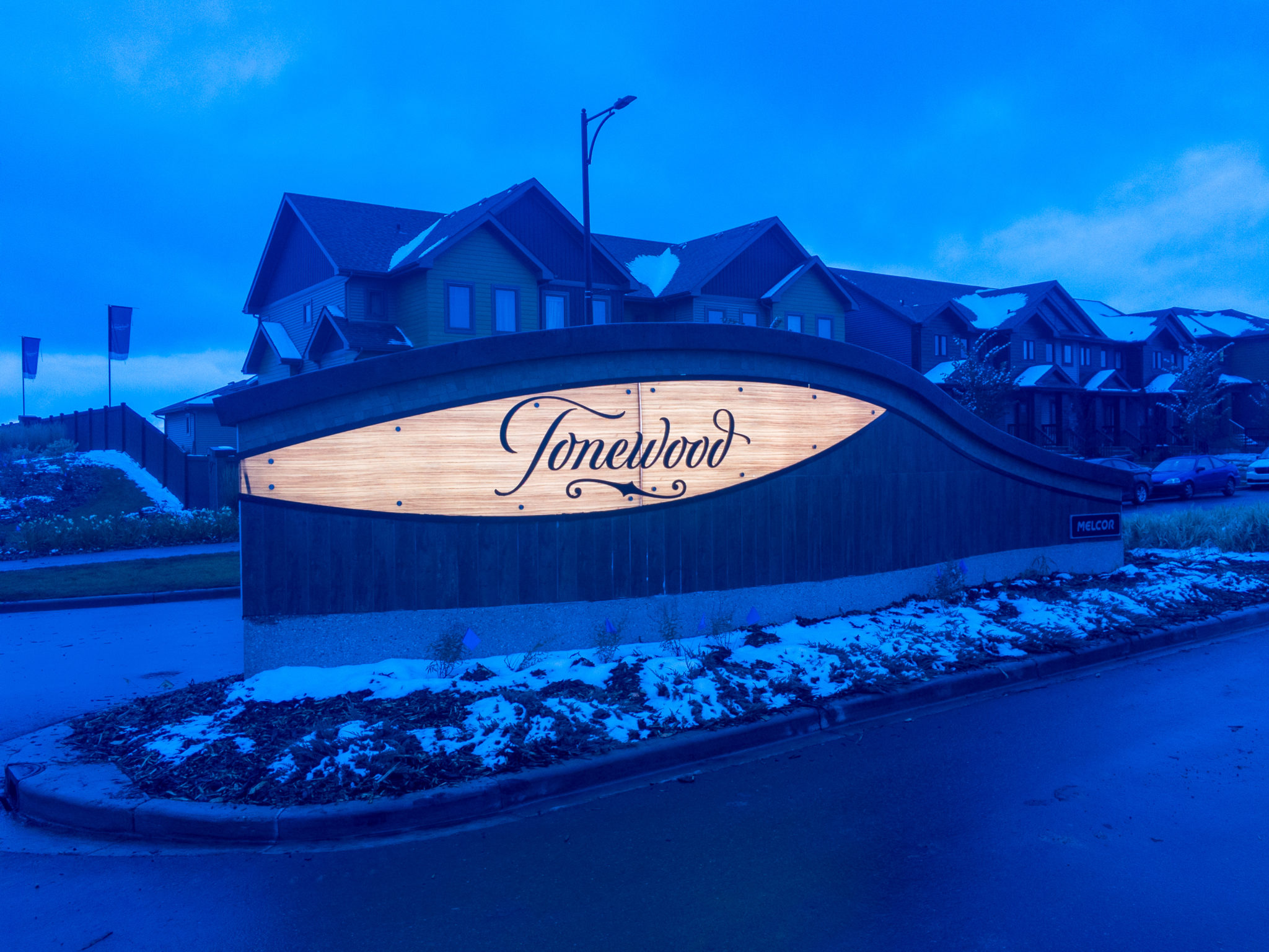Entrance feature driving into the Tonewood Community, lit up at night